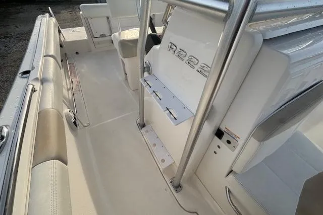 Slide: The Image of 2014 Robalo R222 Center Console interior with seating and console details. - 25