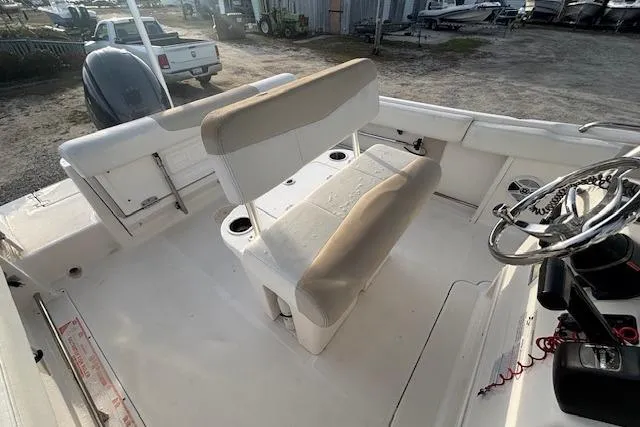 Slide: The Image of 2014 Robalo R222 Center Console boat interior with seating and steering wheel. - 26