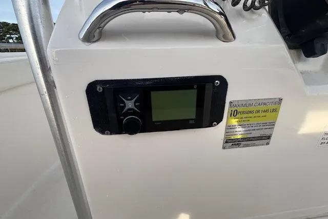 Slide: The Image of 2014 Robalo R222 Center Console dashboard with capacity label and control panel. - 29