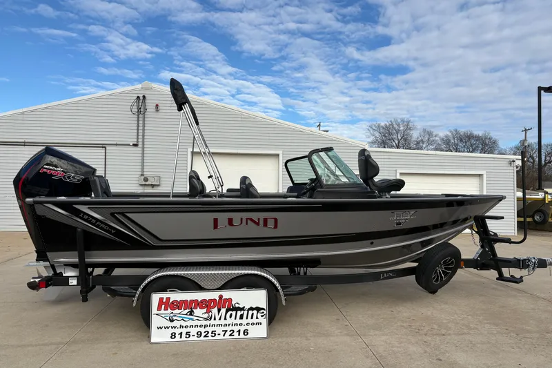 The Image of 2026 Lund 1975 Pro-V Sport boat on trailer at Hennepin Marine dealership. - 1