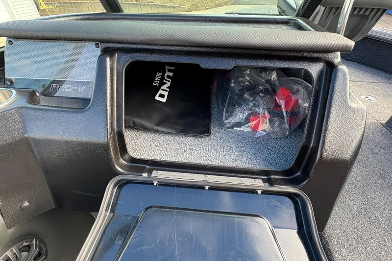 Slide: The Image of Interior storage compartment of 2026 Lund 1975 Pro-V Sport boat. - 23