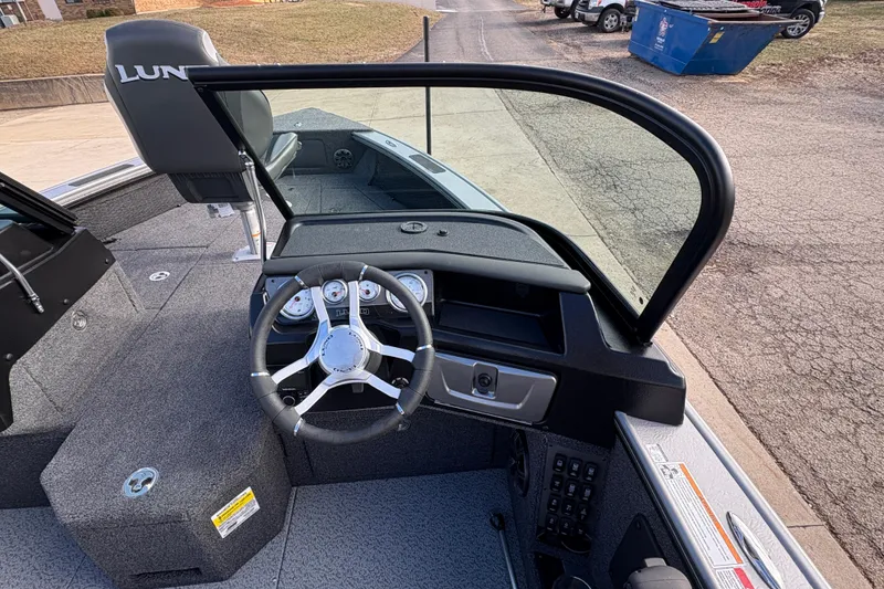 Slide: The Image of Interior view of 2026 Lund 1975 Pro-V Sport boat with steering wheel and dashboard. - 24