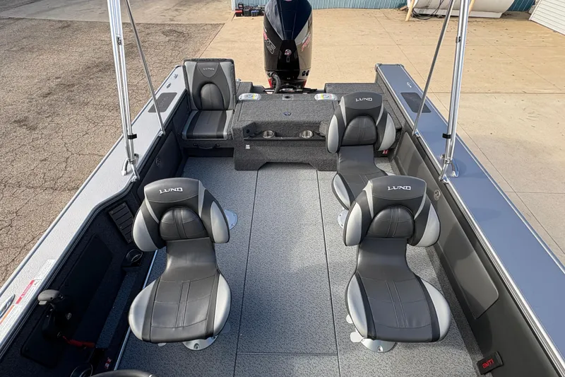 Slide: The Image of 2026 Lund 1975 Pro-V Sport boat interior with four cushioned seats and modern design. - 25