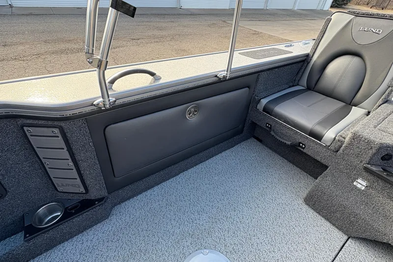Slide: The Image of Interior of 2026 Lund 1975 Pro-V Sport boat with gray seating and storage. - 29