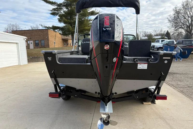 Slide: The Image of 2026 Lund 1975 Pro-V Sport boat with powerful V8 engine, parked outdoors. - 3