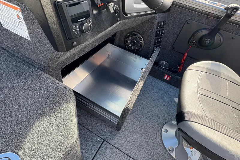 Slide: The Image of Interior of 2026 Lund 1975 Pro-V Sport boat with open storage compartment. - 34