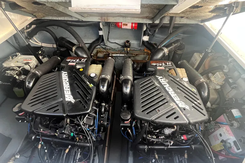 Slide: The Image of Engine compartment of a 2004 Sea Ray 340 Sundancer with twin Mercury engines. - 16