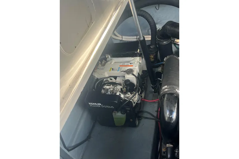 Slide: The Image of Engine compartment of 2004 Sea Ray 340 Sundancer with Kohler power system. - 17