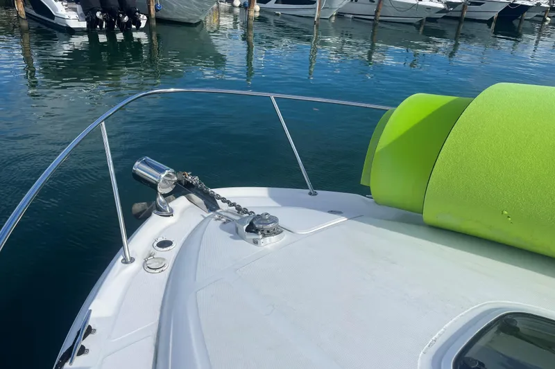 Slide: The Image of Bow of 2004 Sea Ray 340 Sundancer with anchor and bright green mat. - 6