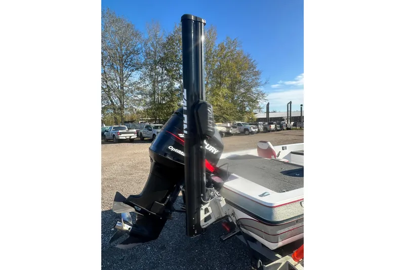 Slide: The Image of 2004 Bumble Bee Pro Vee XT boat with Mercury outboard motor in a parking lot. - 10