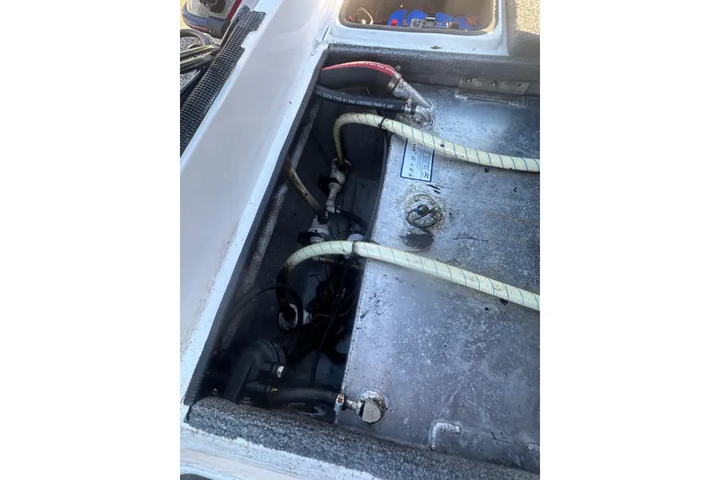 Slide: The Image of 2004 Bumble Bee Pro Vee XT boat interior with visible wiring and components. - 20