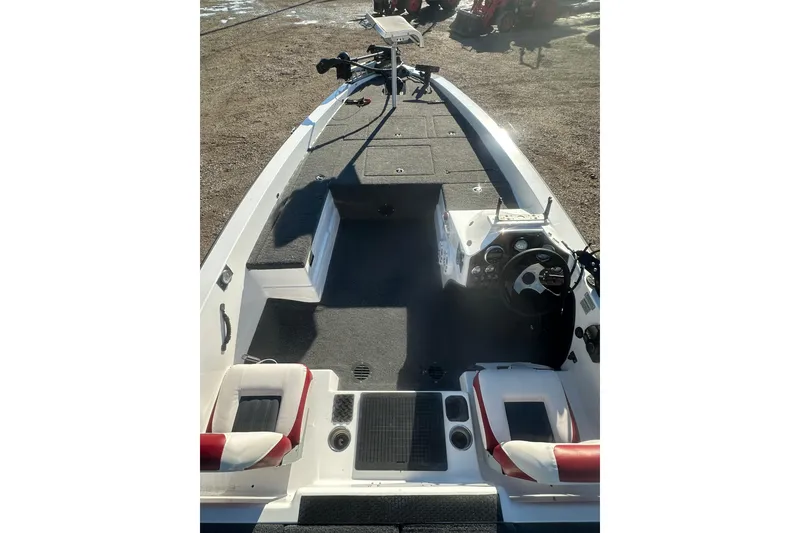 Slide: The Image of 2004 Bumble Bee Pro Vee XT boat interior with steering wheel and seating. - 21