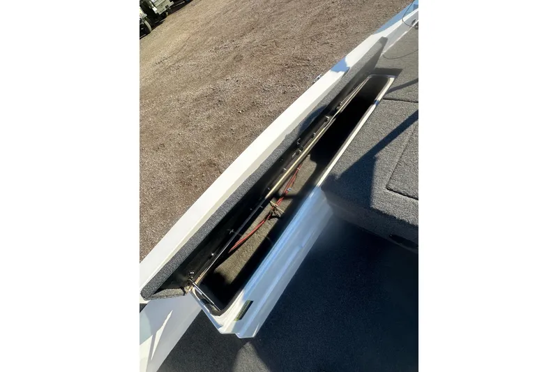 Slide: The Image of Open storage compartment in 2004 Bumble Bee Pro Vee XT boat. - 27