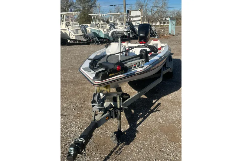 Slide: The Image of 2004 Bumble Bee Pro Vee XT boat on trailer in outdoor lot. - 3