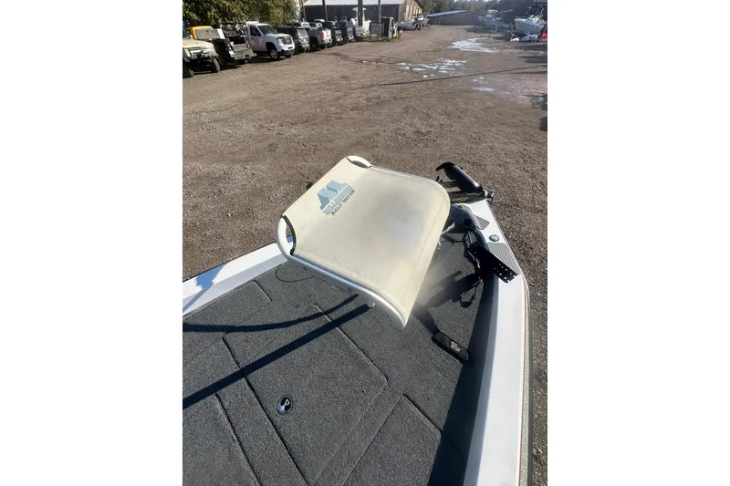 Slide: The Image of 2004 Bumble Bee Pro Vee XT boat with a fishing seat on deck. - 32