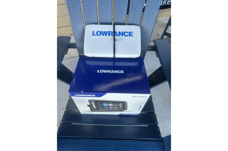Slide: The Image of Lowrance Elite fish finder box on a chair, 2004 Bumble Bee Pro Vee XT. - 37