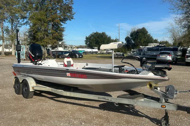 Slide: The Image of 2004 Bumble Bee Pro Vee XT boat on trailer in outdoor setting. - 42