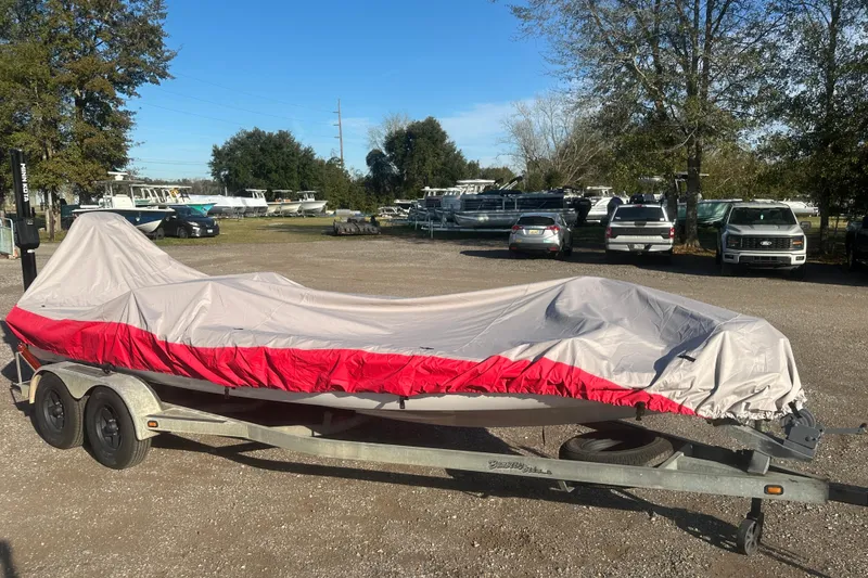 Slide: The Image of 2004 Bumble Bee Pro Vee XT boat on trailer in outdoor lot. - 44