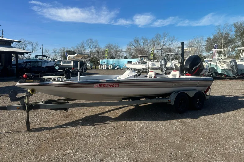 Slide: The Image of 2004 Bumble Bee Pro Vee XT boat on trailer in outdoor dealership lot. - 45