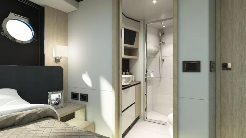 Slide: The Image of Luxurious interior of 2024 Absolute 48 Coupe yacht featuring a modern bedroom and bathroom. - 15