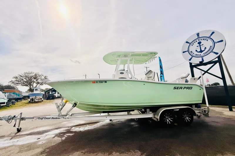 Slide: The Image of 2023 Sea Pro 239 Center Console boat on trailer, viewed from front, in outdoor setting. - 11