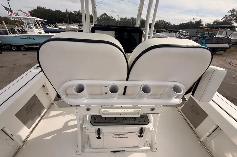 Slide: The Image of 2023 Sea Pro 239 Center Console boat interior with rod holders and seating. - 18