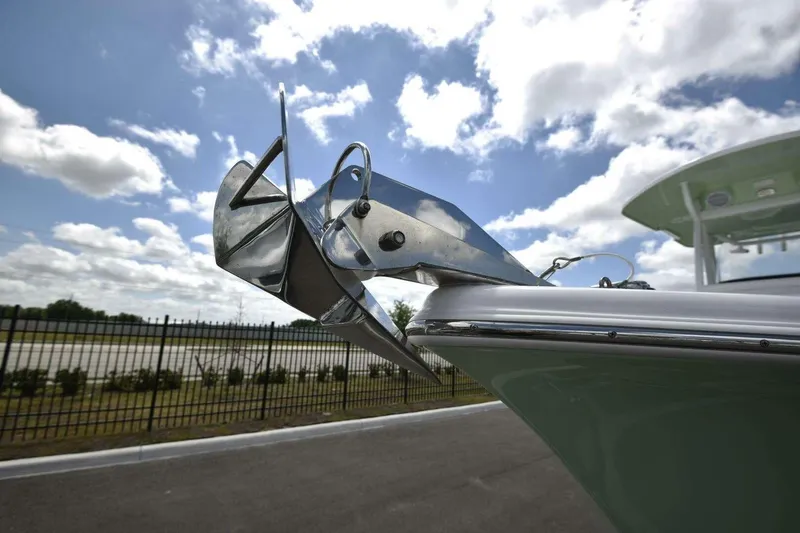 Slide: The Image of 2023 Sea Pro 239 Center Console dashboard with steering wheel, controls, and cup holders. - 23