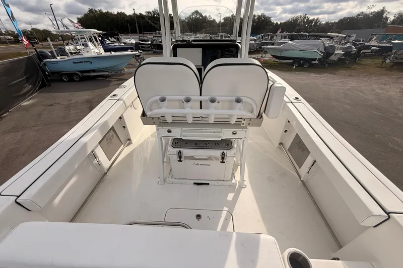 Slide: The Image of Audio control panel on 2023 Sea Pro 239 Center Console boat with dual cup holders. - 27