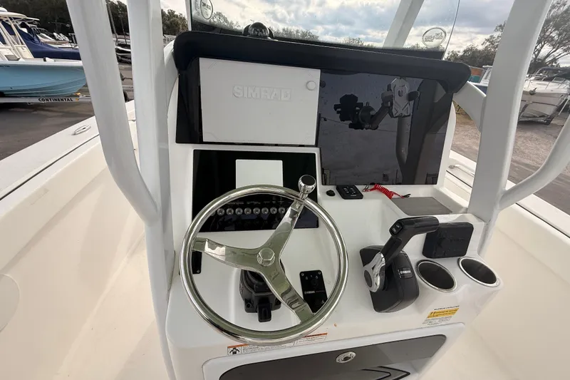 Slide: The Image of 2023 Sea Pro 239 Center Console boat interior with seating and safety equipment. - 34