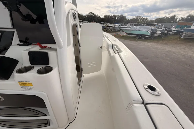 Slide: The Image of 2023 Sea Pro 239 Center Console boat interior with toilet and sink. - 36