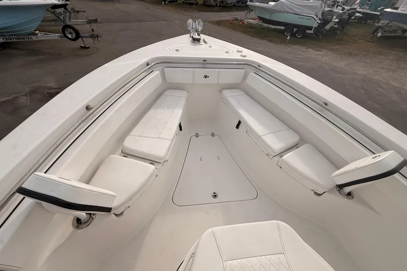 Slide: The Image of 2023 Sea Pro 239 Center Console interior with storage hatch and porthole window. - 39