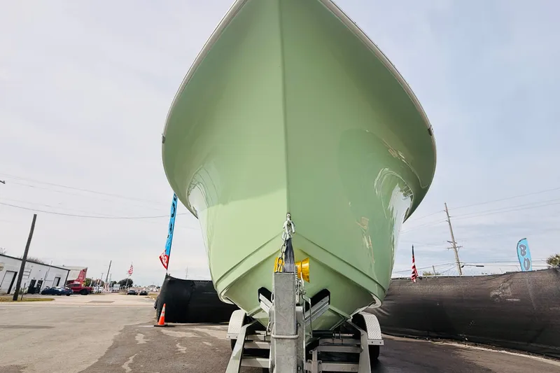 Slide: The Image of 2023 Sea Pro 239 Center Console boat with powerful outboard motor on trailer. - 4