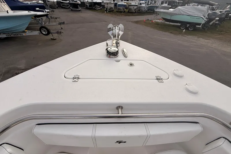 Slide: The Image of Interior of 2023 Sea Pro 239 Center Console boat, featuring storage and portholes. - 40