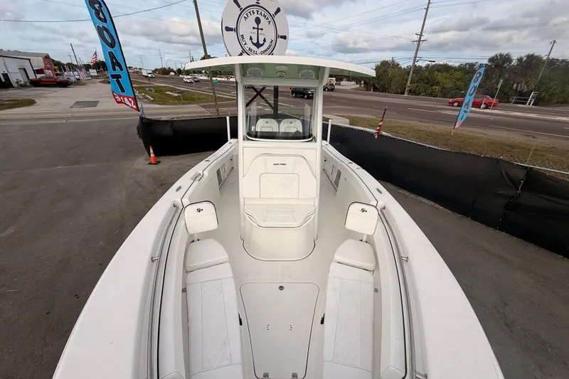 Slide: The Image of 2023 Sea Pro 239 Center Console boat interior with white cushioned seating. - 42