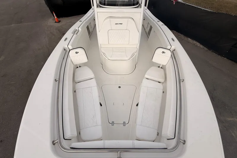 Slide: The Image of 2023 Sea Pro 239 Center Console boat interior with seating, displayed at a boat sale. - 44