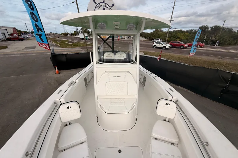 Slide: The Image of 2023 Sea Pro 239 Center Console boat seat with white cushioned upholstery. - 45