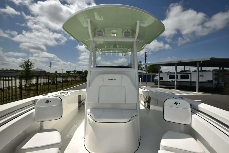 Slide: The Image of 2023 Sea Pro 239 Center Console boat interior with white cushioned seating. - 47