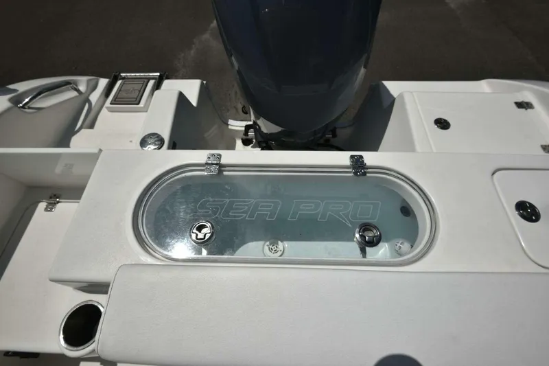 Slide: The Image of 2023 Sea Pro 239 Center Console boat deck with anchor and rope storage. - 52