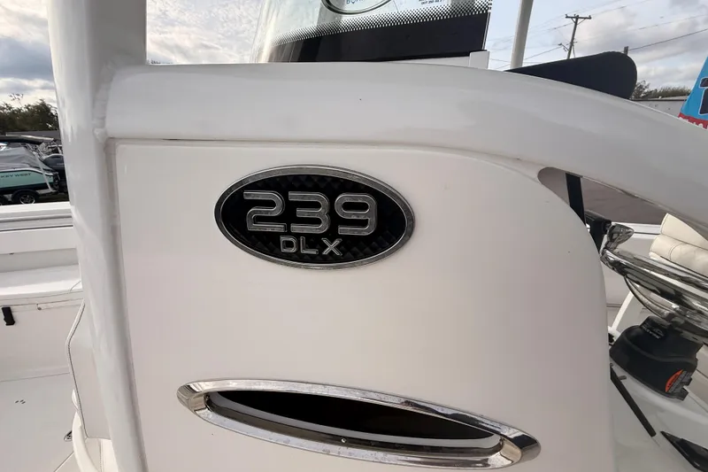 Slide: The Image of 2023 Sea Pro 239 Center Console boat displayed outdoors, showcasing spacious seating and modern design. - 56