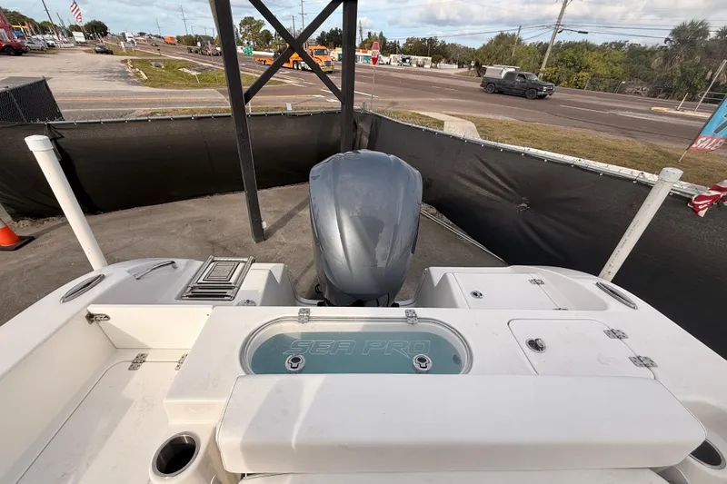 Slide: The Image of 2023 Sea Pro 239 Center Console boat with outboard motor, displayed outdoors. - 61
