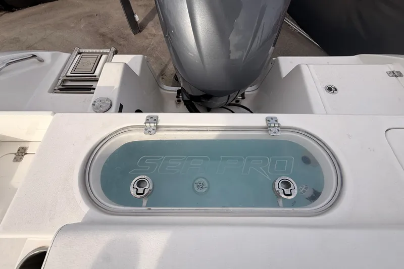 Slide: The Image of 2023 Sea Pro 239 Center Console boat with livewell and outboard motor. - 63