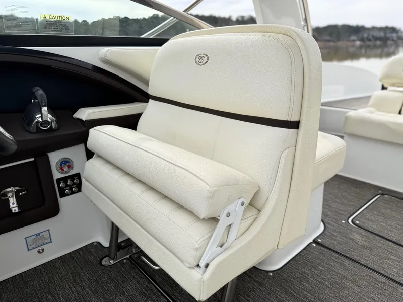 Slide: The Image of Captain's seat on 2021 Cobalt R30 boat, featuring luxurious white upholstery and sleek design. - 10
