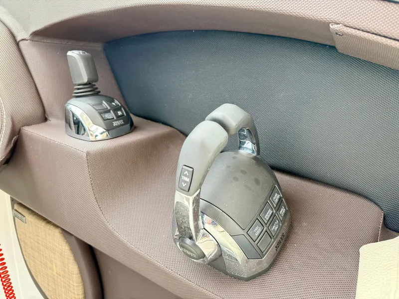 Slide: The Image of Control panel of a 2021 Cobalt R30 boat, featuring modern joystick and throttle controls. - 12