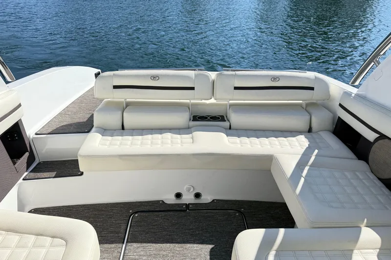 Slide: The Image of 2021 Cobalt R30 boat interior with white seating and water view. - 13