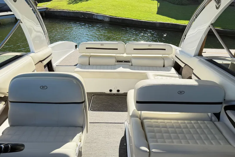 Slide: The Image of 2021 Cobalt R30 boat interior with luxurious white seating and elegant design. - 15