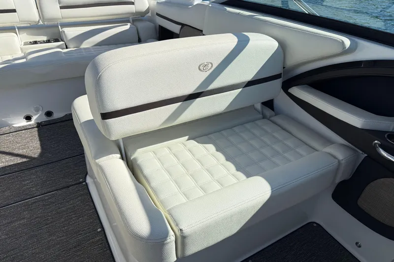 Slide: The Image of 2021 Cobalt R30 boat interior with white cushioned seating and elegant design. - 16