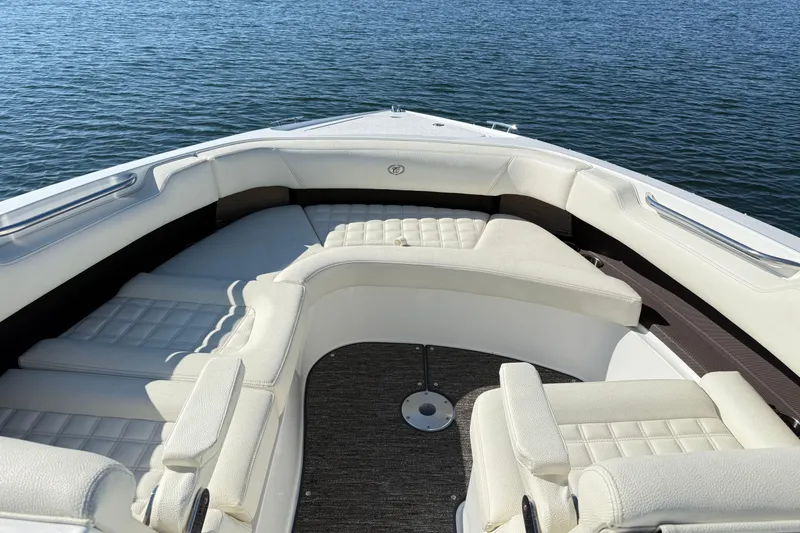 Slide: The Image of Luxurious seating on 2021 Cobalt R30 boat, overlooking serene water. - 17