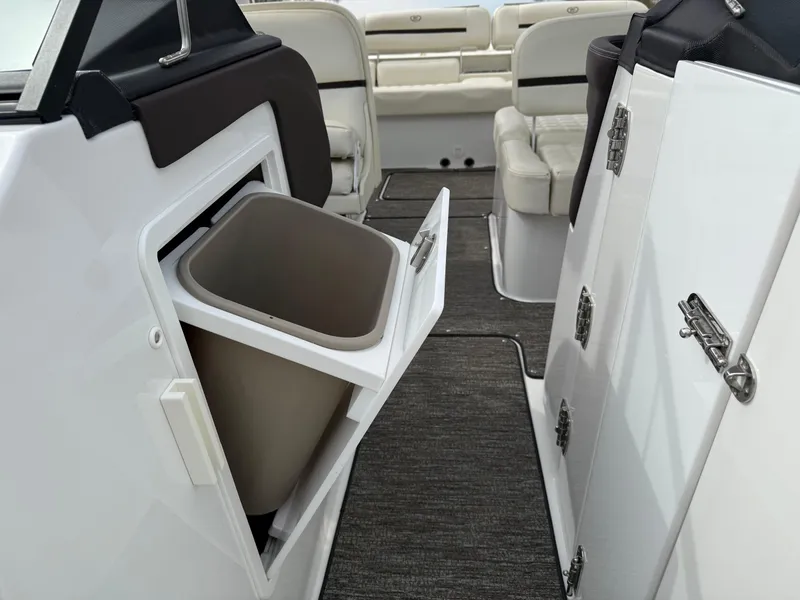 Slide: The Image of Interior of 2021 Cobalt R30 boat with open storage compartment and seating. - 22