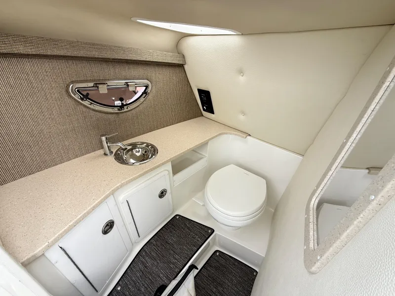Slide: The Image of 2021 Cobalt R30 boat interior bathroom with sink and toilet. - 23