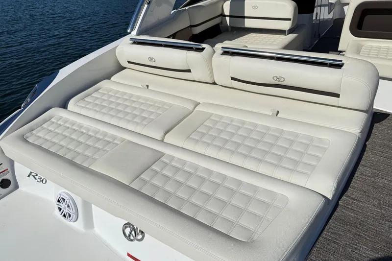 Slide: The Image of Luxury seating on 2021 Cobalt R30 boat, featuring white cushioned upholstery. - 25